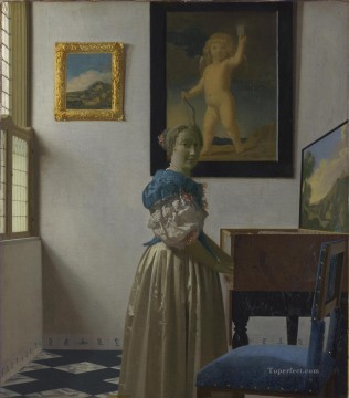 Johannes Vermeer Painting - Mujer joven de pie ante un barroco virginal de Johannes Vermeer